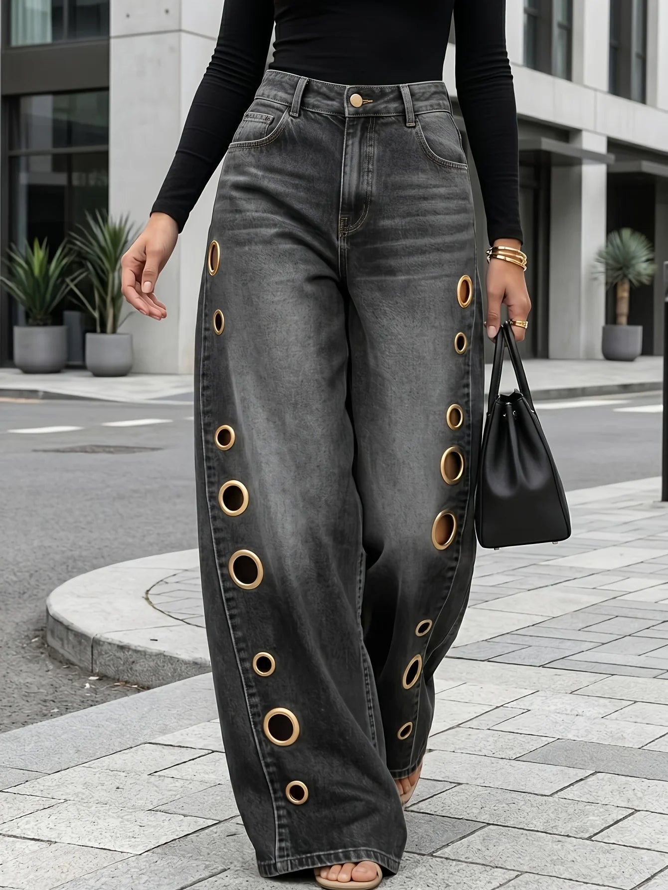Retro-style wide-leg jeans with metallic eyelets, high-waisted, loose, floor-length fit, gradient eyelets of varying...