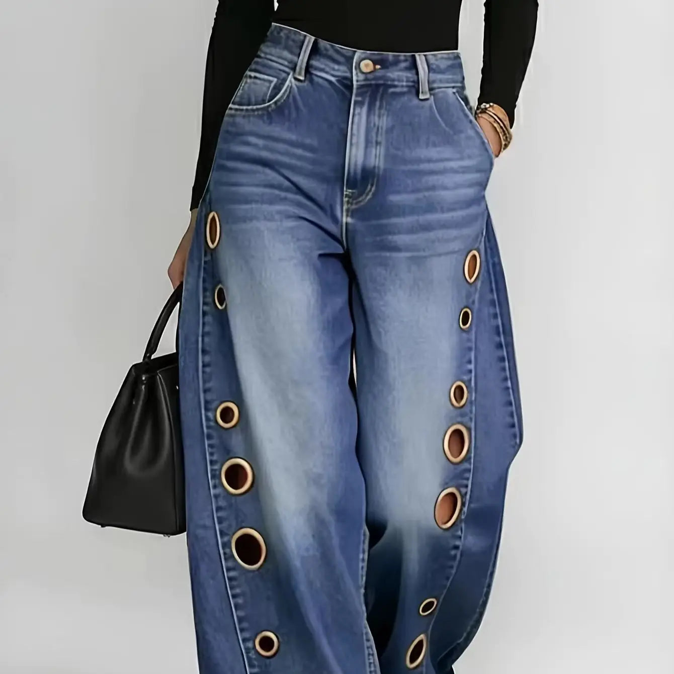 Retro-style wide-leg jeans with metallic eyelets, high-waisted, loose, floor-length fit, gradient eyelets of varying...