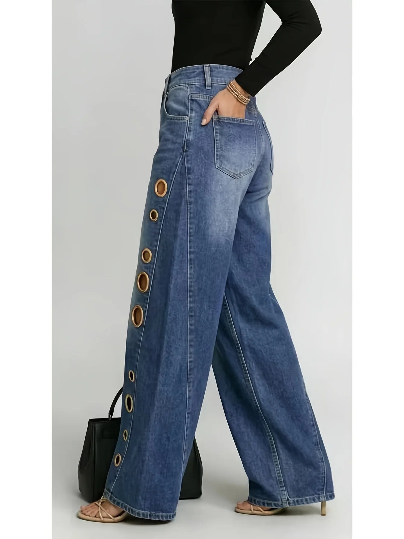 Retro-style wide-leg jeans with metallic eyelets, high-waisted, loose, floor-length fit, gradient eyelets of varying...