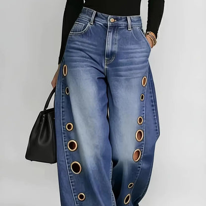 Retro-style wide-leg jeans with metallic eyelets, high-waisted, loose, floor-length fit, gradient eyelets of varying...