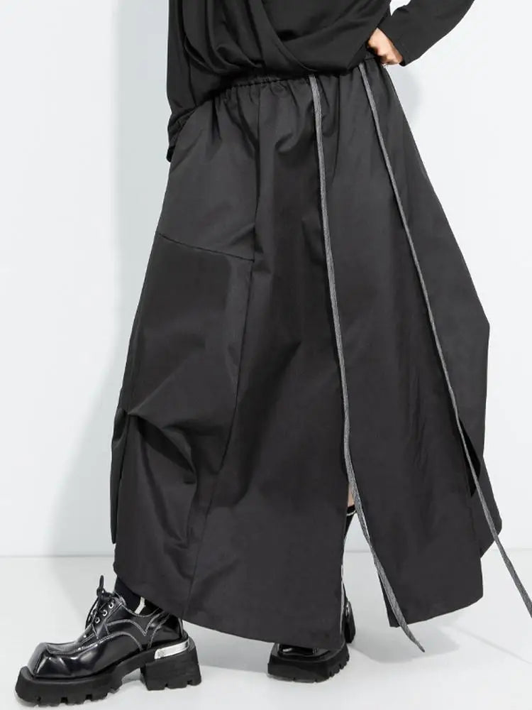 [EAM] High Elastic Waist Black Irregular Slit Casual A‑Line Half‑body Skirt Women Fashion Tide New Spring Autumn 2026...