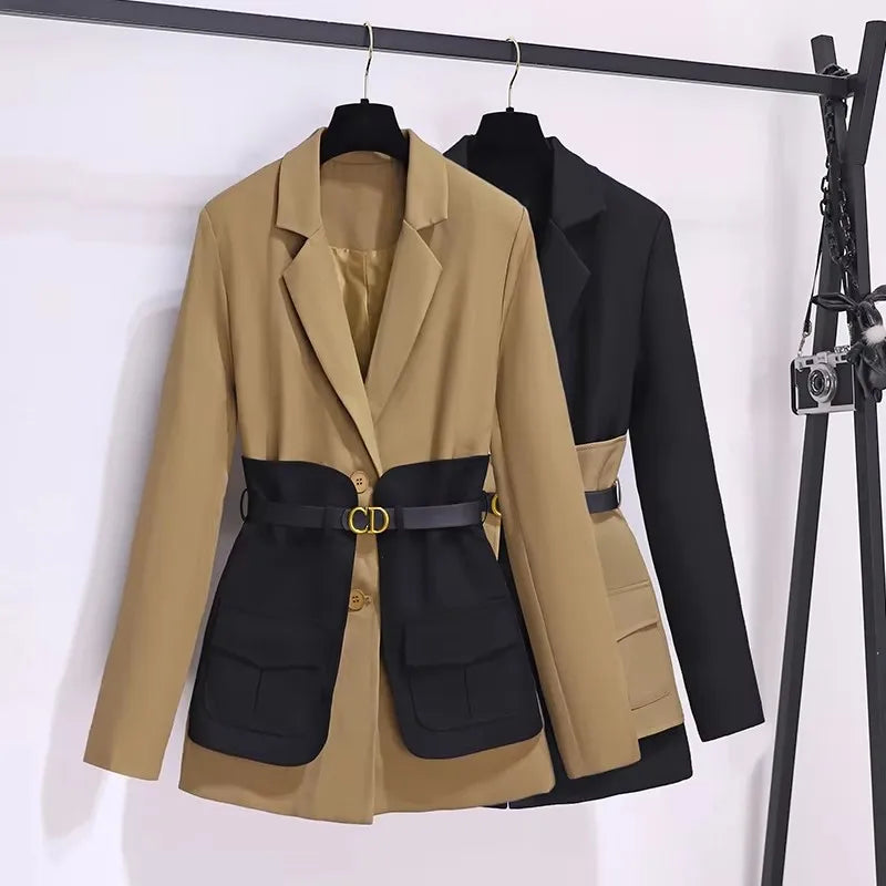 Two blazers, one beige and one black, on hangers against a white background.