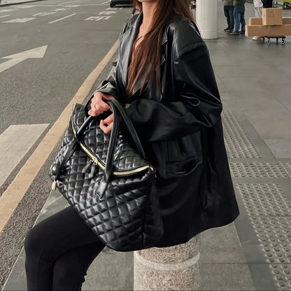 Stylish Vintage Black Quilted Handbag With Exquisite Gold‑Toned Hardware And Lock Details. Spacious And...