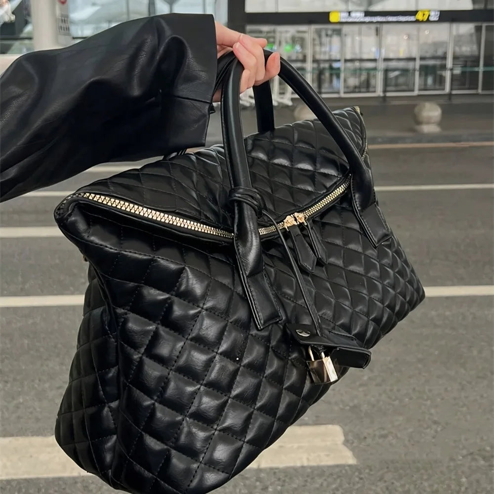 Stylish Vintage Black Quilted Handbag With Exquisite Gold‑Toned Hardware And Lock Details. Spacious And...