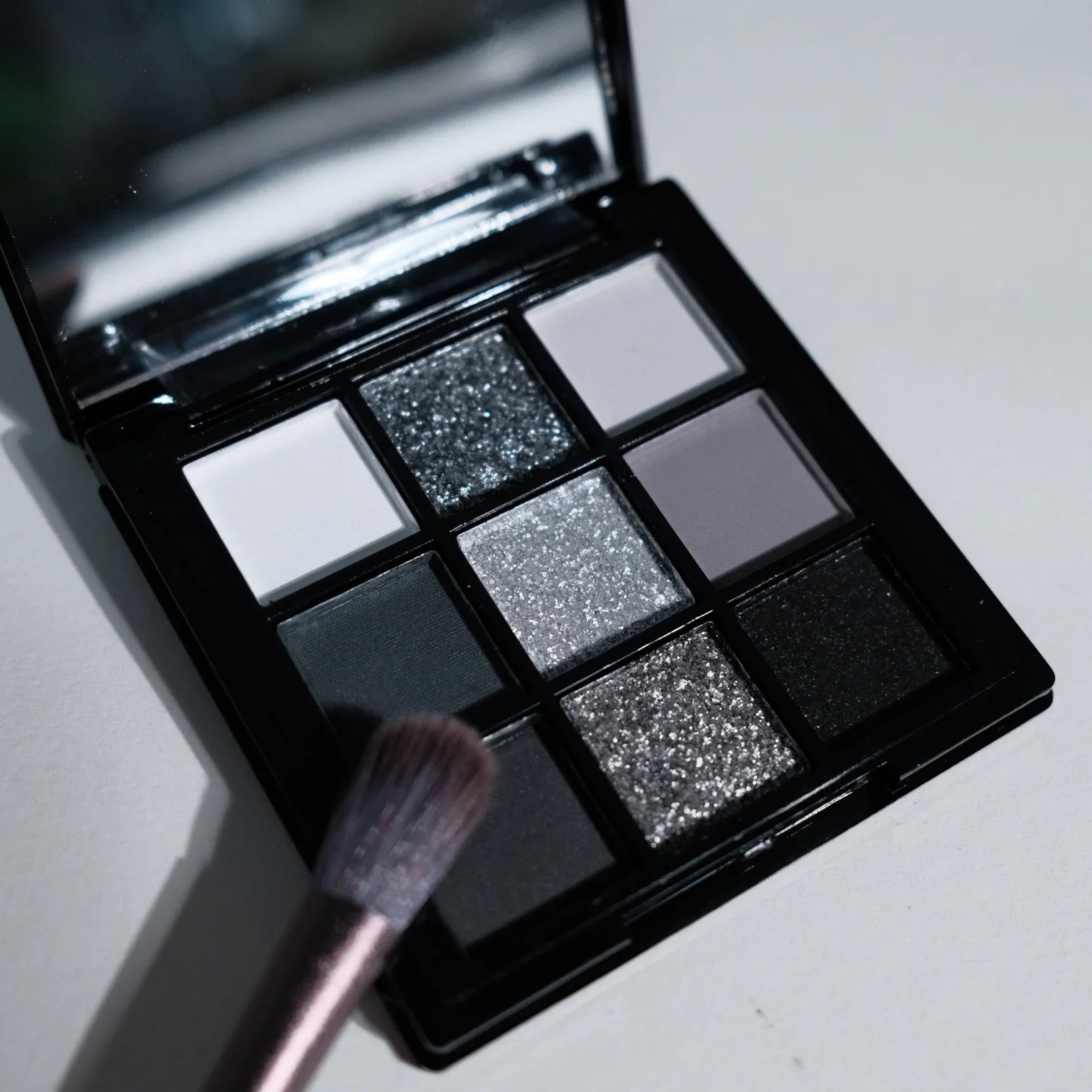 9-shade eyeshadow palette: Black Swan, Smoky, Dark Black, Grey Silver Glitter, Matte Finish, Long-lasting, and easy to...