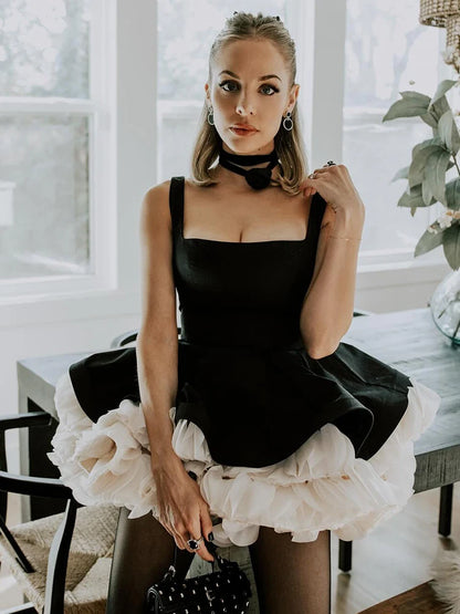 VC Elegant Black Mini Dress with Peplum and White Ruffle Accents for Upscale Casual Gatherings